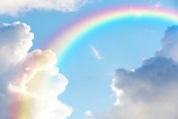 Picturesque view of beautiful rainbow and blue sky on sunny day 