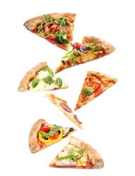 Set with slices of different pizzas falling on white background
