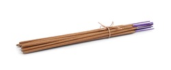 Many aromatic incense sticks tied with twine on white background