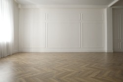 Parquet floor in light spacious empty room
