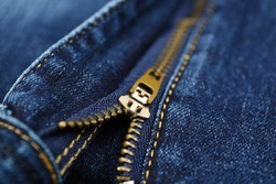 Blue jeans with zipper as background, closeup view
