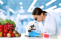 Quality control specialist inspecting food in laboratory