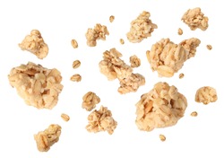 Delicious granola falling on white background. Healthy snack  