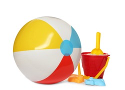 Inflatable colorful beach ball and child plastic toys on white background