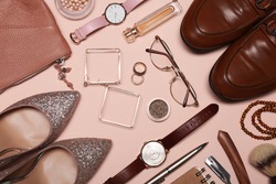 Flat lay composition with fashionable woman's and man's accessories on pink background
