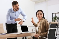 Boss screaming at employee in office. Toxic work environment