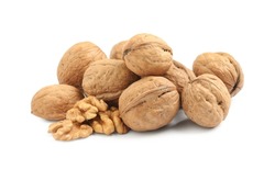 Pile of ripe walnuts on white background