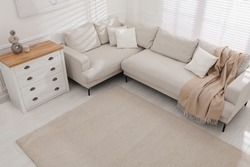 Stylish soft carpet on floor in living room, above view