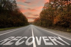 Start to live without alcohol addiction. Word RECOVERY on asphalt highway