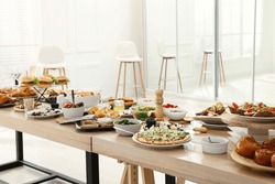 Brunch table setting with different delicious food indoors