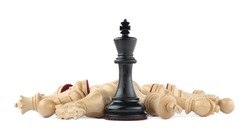 King among fallen chess pieces on white background