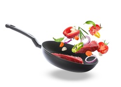 Tasty fresh ingredients and frying pan on white background