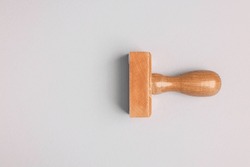 One wooden stamp tool on light grey background, top view. Space for text