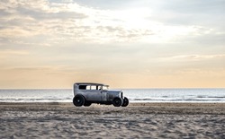 Very nice old grey vintage, classic car from around 1930 on the beach in Rømø Denmark