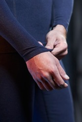 a man in a tactical blue turtleneck. close-up of the arms, sleeves of a military-colored tactical turtleneck. mens military tactical clothing