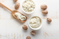 Composition with shea butter on light background