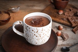 Cup of hot chocolate on wooden table