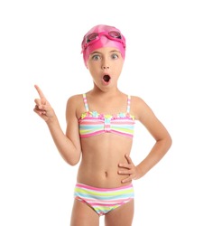 Surprised little girl in swimsuit on white background