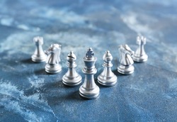 Chess figures on color background