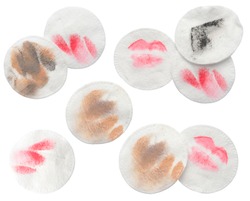 Cotton pads after makeup removal on white background