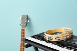 Different musical instruments on color background, closeup