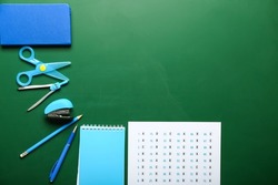 Stationery and answer sheet on blackboard