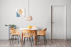 Dining table with lemons in interior of room