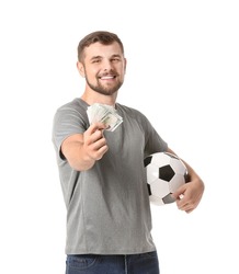 Young man with soccer ball and money on white background. Concept of sports bet