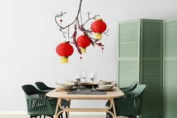 Beautiful table setting for Chinese New Year celebration in room