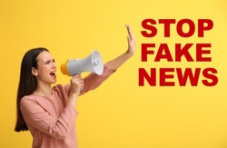Screaming young woman with megaphone and text STOP FAKE NEWS on yellow background