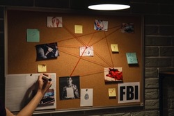 Detective processing evidence in FBI agent's office