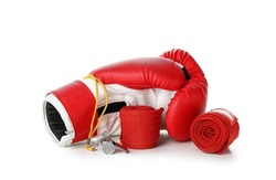 Boxing gloves with whistle and bandage on white background