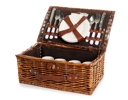Wicker basket with tableware for picnic on white background