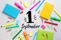 Bright school supplies and text 1 SEPTEMBER on light background