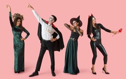 Set of people dressed for Halloween on pink background