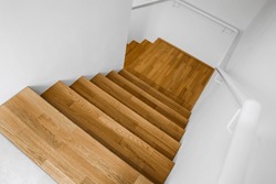 Wooden stairs in modern building, top view