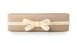 Gift box wrapped in craft paper with velvet ribbon on white background