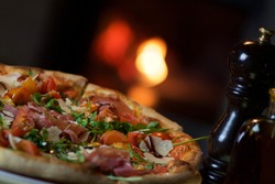 Crispy Italian pizza right out of the wood oven. Are you hungry already?