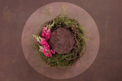 Natural wreath with pink flower and brown background for composite digital background
