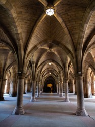 Historic cathedral hallway with beautiful arches in old stone castle