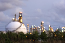Blurred Photo bokeh for sphere tank oil and gas refinery at twilight