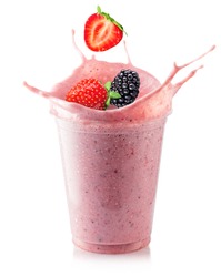 cold milkshake or smoothie with ice and fresh berries in disposable plastic glass isolated on white background