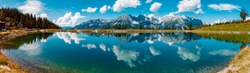 High resolution stitched panorama of a beautiful alpine summer view with reflections in a lake at the famous Astberg summit, Going, Wilder Kaiser, Tyrol, Austria