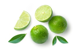 Lime fruits with green leaf and cut in half slice isolated on white background, top view, flat lay.