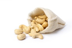 Cashew nuts in sack bag isolated on white background.