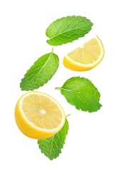 Peppermint leaves (Mint leaf) and fresh lemon slice flying in the air isolated on white background.