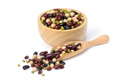 Mix organic beans with soybean, red beans, green mung bean and black gram) in wooden bowl and scoop isolated on white background. 