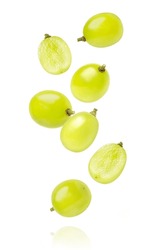 Green grapes with cut in half sliced flying in the air isolated on white background.