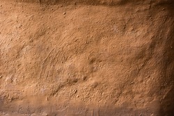 Soil wall texture of old clay house structure. Mud background. Soft picture,vintage tone