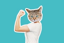 Strong woman headed by cat head raises arm and shows bicep isolated on a color blue background. Support animal rights, activism. Trendy collage in magazine style. Contemporary art. Modern design